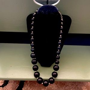 Black and white necklace with small and large round beads